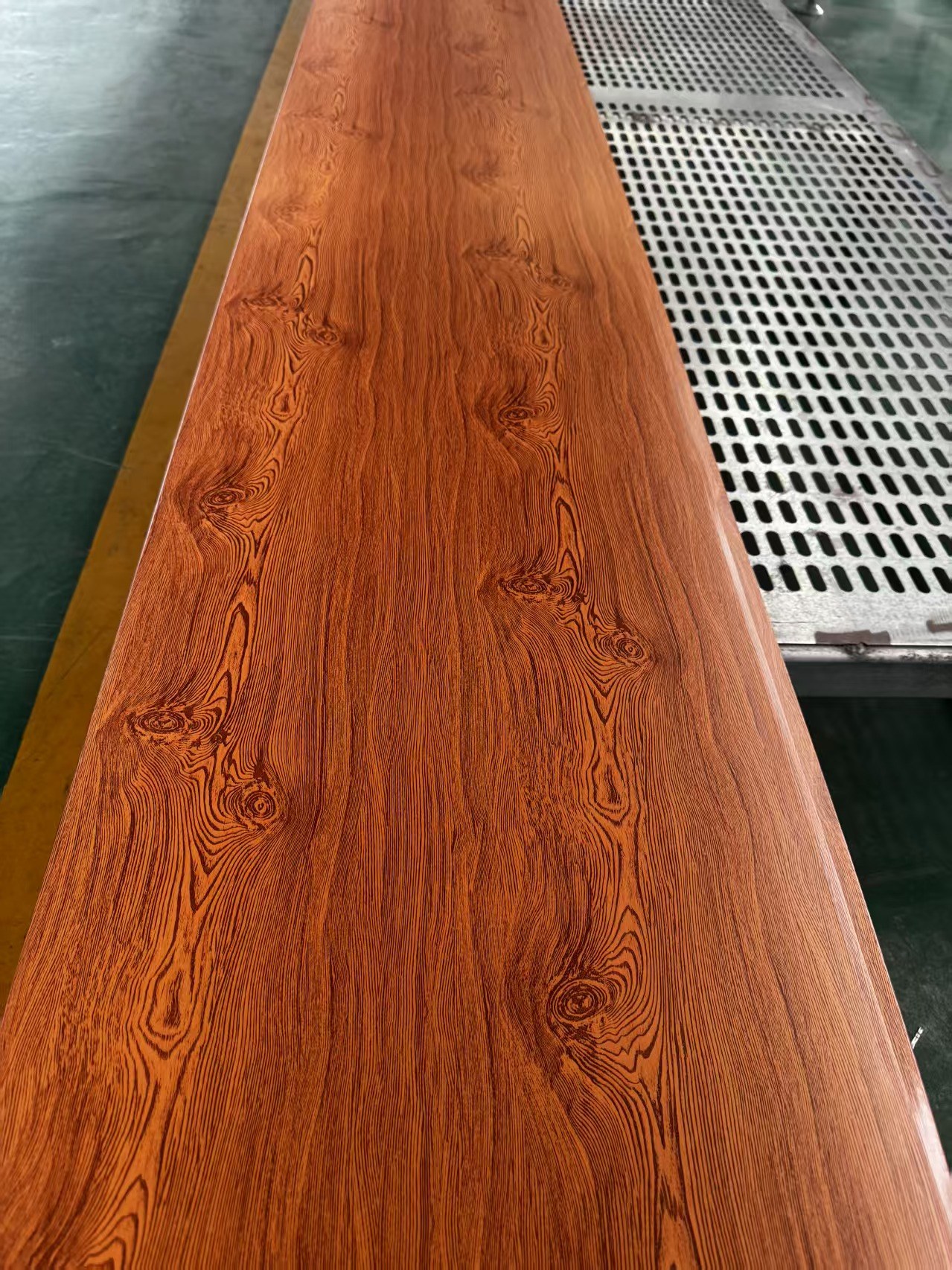 Orange wood grain insulated metal wall panel